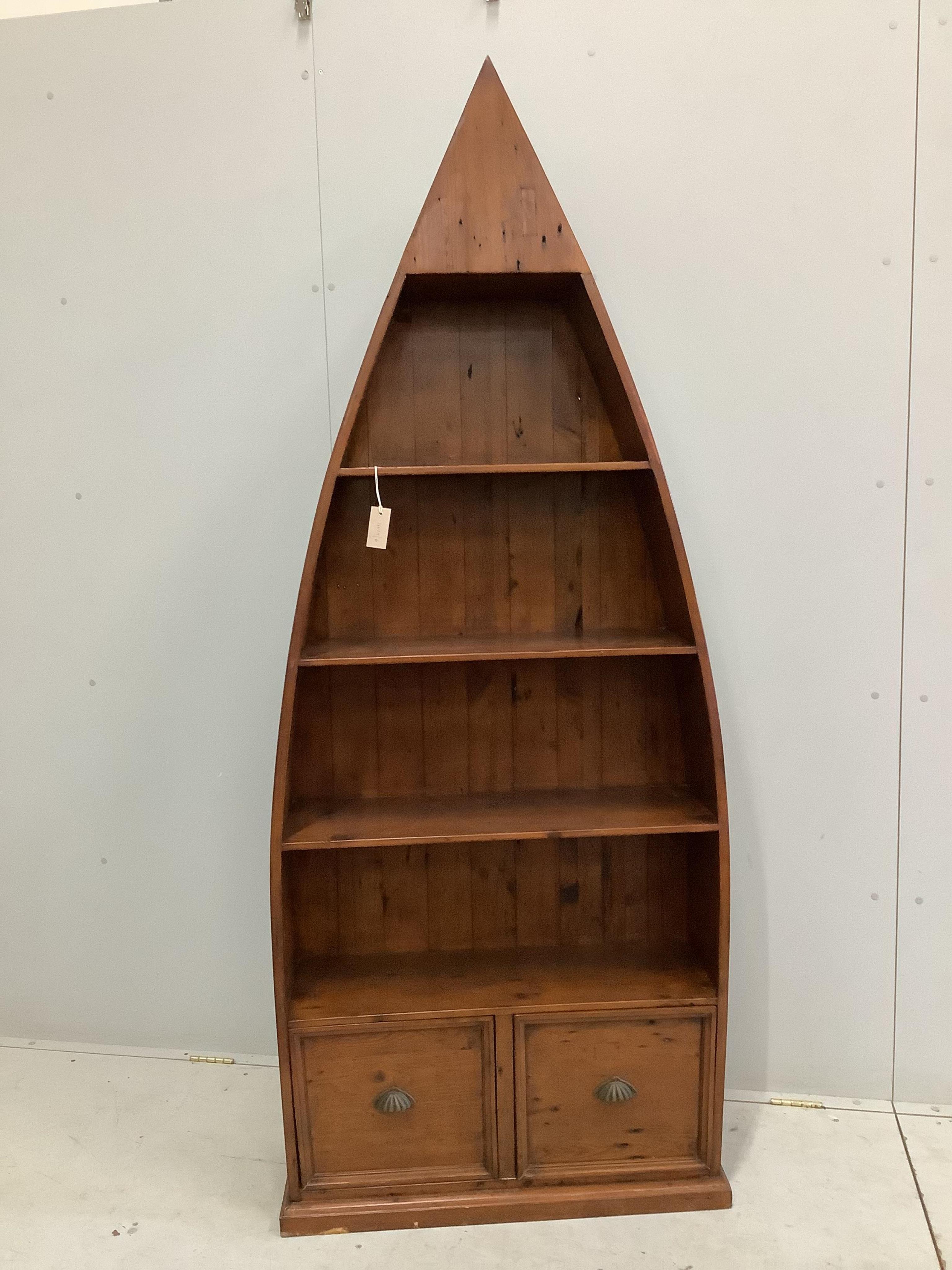 A reproduction Barker and Stonehouse hardwood boat shaped two drawer bookcase, width 83cm, depth 32cm, height 204cm. Condition - fair to good